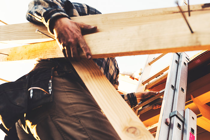 A Close-up View of a Worker Highlighting Re-roofing Service in Logan, UT